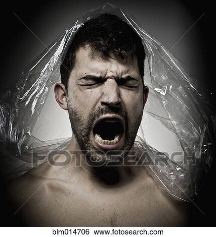 Man shouting with plastic on his head View Large Photo Image Stock Photograph - Man shouting with plastic on his head. Fotosearch
