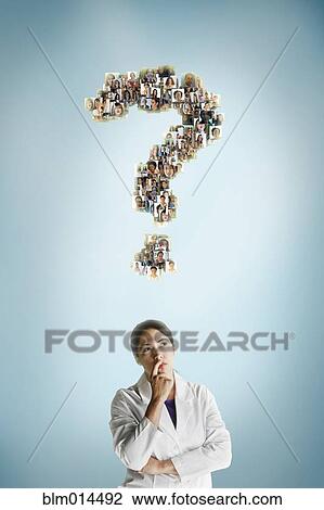 Stock Image - Mixed race scientist underneath question mark collage. Fotosearch