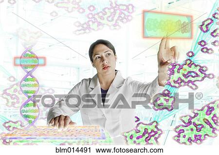 Stock Image - Mixed race scientist working with scientific images. Fotosearch