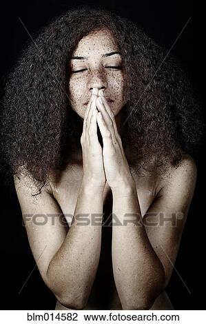 Mixed race woman praying View Large Photo Image Stock Image - Mixed race woman praying. Fotosearch
