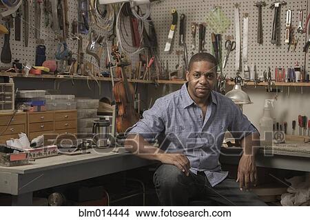 Picture - Native American man in music workshop. Fotosearch