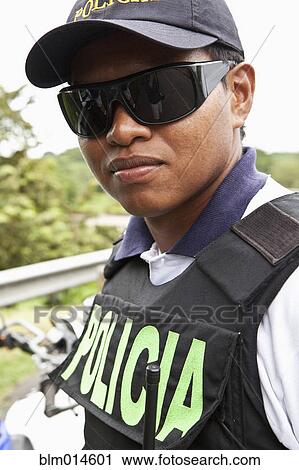 Policeman in bulletproof vest and sunglasses View Large Photo Image Stock Image - Policeman in bulletproof vest and sunglasses. Fotosearch
