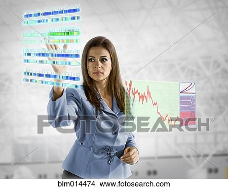 Scientific images surrounding Hispanic businesswoman View Large Photo Image Picture - Scientific images surrounding Hispanic businesswoman. Fotosearch