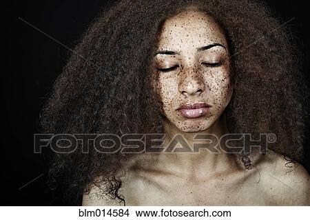 Serious, freckled mixed race woman View Large Photo Image Picture - Serious, freckled mixed race woman. Fotosearch