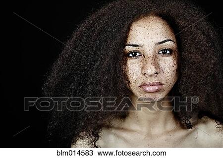 Serious, freckled mixed race woman View Large Photo Image Stock Image - Serious, freckled mixed race woman. Fotosearch