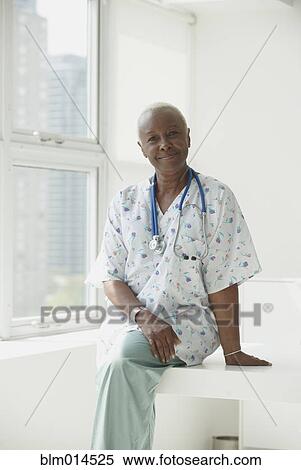 Stock Photography - Smiling Black nurse. Fotosearch