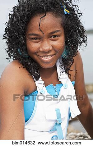 Stock Image - Smiling teenage girl. Fotosearch
