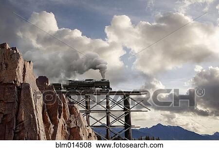 Train about to cross broken bridge View Large Photo Image Stock Photo - Train about to cross broken bridge. Fotosearch