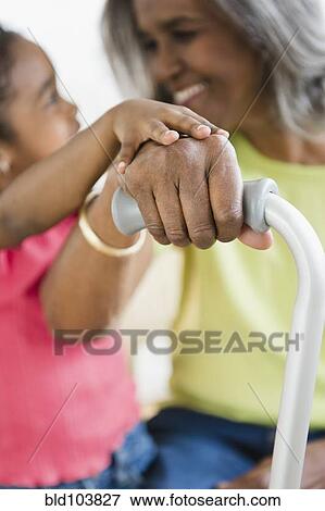 African American girl holding hands with grandmother View Large Photo Image Stock Photo - African American girl holding hands with grandmother. Fotosearch
