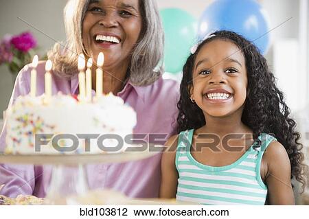 African American grandmother and granddaughter with birthday cake View Large Photo Image Stock Image - African American grandmother and granddaughter with birthday cake. Fotosearch