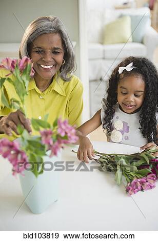 African American grandmother and granddaughter arranging flowers View Large Photo Image Stock Photo - African American grandmother and granddaughter arranging flowers. Fotosearch
