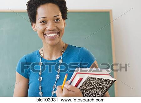 African American woman carrying school books View Large Photo Image Stock Image - African American woman carrying school books. Fotosearch