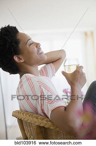 African American woman drinking white wine View Large Photo Image Stock Photograph - African American woman drinking white wine. Fotosearch
