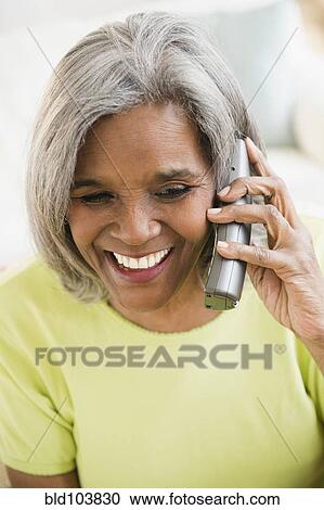 African American woman talking on telephone View Large Photo Image Stock Image - African American woman talking on telephone. Fotosearch