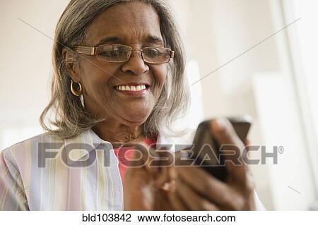 African American woman using cell phone View Large Photo Image Stock Image - African American woman using cell phone. Fotosearch