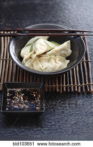 Stock Image - Asian dumplings in bowl. Fotosearch