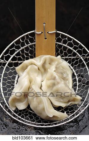 Asian dumplings in strainer View Large Photo Image Stock Image - Asian dumplings in strainer. Fotosearch
