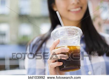 Asian woman drinking iced coffee View Large Photo Image Stock Image - Asian woman drinking iced coffee. Fotosearch