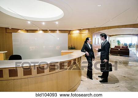 Business people talking in office View Large Photo Image Stock Image - Business people talking in office. Fotosearch