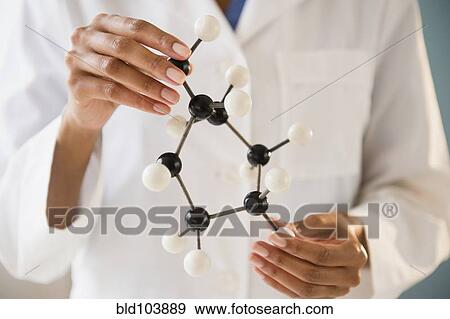 Cape Verdean scientist holding molecule model View Large Photo Image Stock Photo - Cape Verdean scientist holding molecule model. Fotosearch