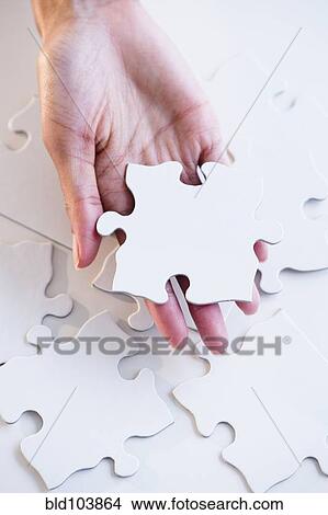 Cape Verdean woman holding puzzle piece View Large Photo Image Picture - Cape Verdean woman holding puzzle piece. Fotosearch