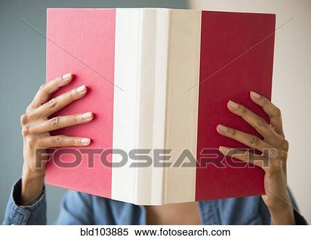 Stock Photography - Cape Verdean woman reading a book. Fotosearch