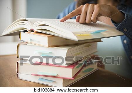 Picture - Cape Verdean woman studying. Fotosearch