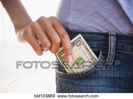 Cape Verdean woman taking dollar bill from pocket View Large Photo Image Stock Photo - Cape Verdean woman taking dollar bill from pocket. Fotosearch