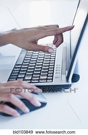 Cape Verdean woman using laptop View Large Photo Image Stock Photo - Cape Verdean woman using laptop. Fotosearch