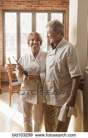 Stock Photo - Caucasian chefs standing in restaurant. Fotosearch