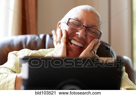 Caucasian woman using digital tablet View Large Photo Image Stock Image - Caucasian woman using digital tablet. Fotosearch