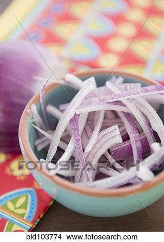 Picture - Chopped red onion in bowl. Fotosearch