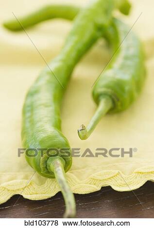 Stock Photo - Close up of green chili peppers. Fotosearch