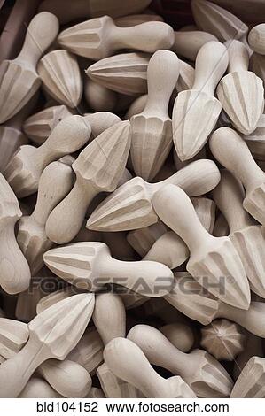 Stock Image - Close up of wooden juicer implements. Fotosearch