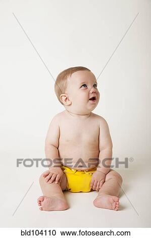 Stock Image - Curious Caucasian baby boy. Fotosearch