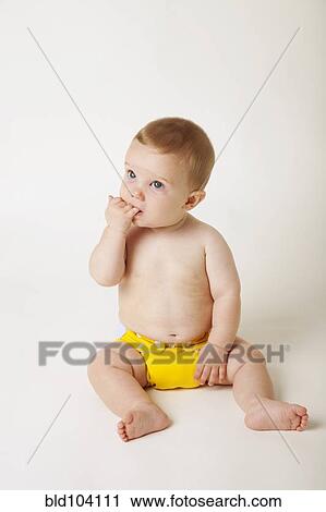 Stock Image - Curious Caucasian baby boy. Fotosearch