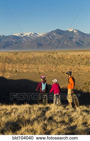 Family mountain biking together View Large Photo Image Stock Image - Family mountain biking together. Fotosearch