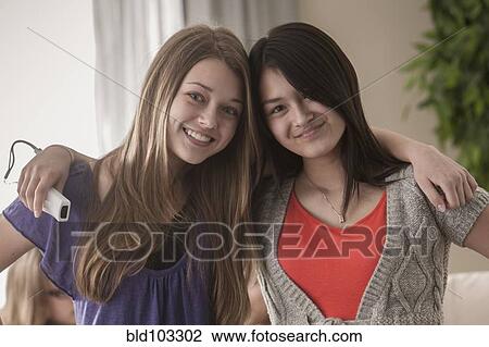 Stock Image - Friends hugging. Fotosearch