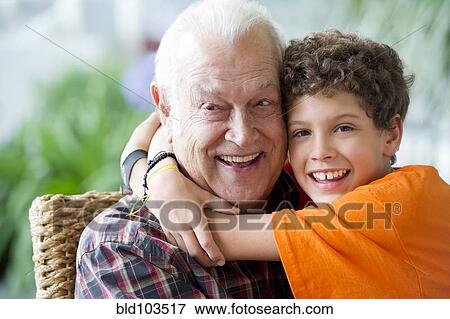 Hispanic boy hugging grandfather View Large Photo Image Stock Photo - Hispanic boy hugging grandfather. Fotosearch
