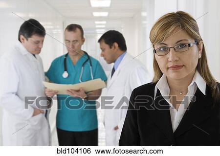 Stock Photograph - Hispanic medical professionals in hospital. Fotosearch