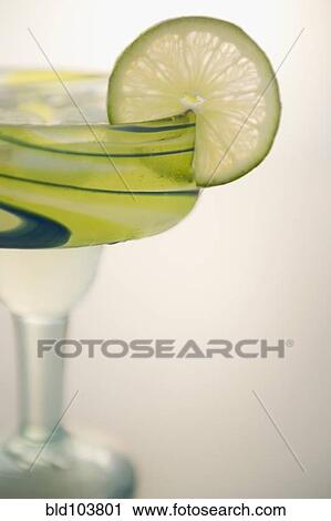 Lime slice on rim of margarita View Large Photo Image Stock Image - Lime slice on rim of margarita. Fotosearch