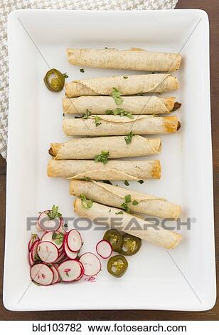 Mexican taquitos on platter View Large Photo Image Stock Image - Mexican taquitos on platter. Fotosearch