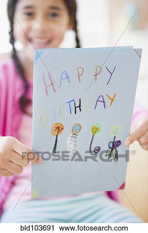 Mixed race girl holding birthday card View Large Photo Image Stock Image - Mixed race girl holding birthday card. Fotosearch