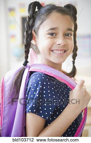 Mixed race girl in backpack View Large Photo Image Stock Image - Mixed race girl in backpack. Fotosearch