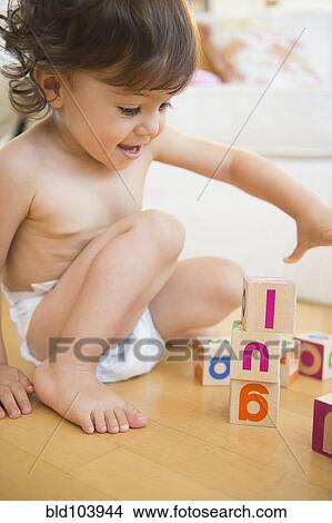 Mixed race girl playing with blocks View Large Photo Image Picture - Mixed race girl playing with blocks. Fotosearch