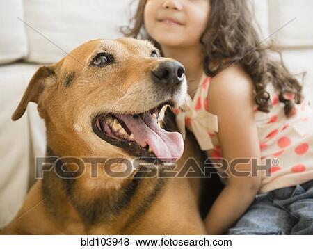 Mixed race girl sitting with dog View Large Photo Image Stock Photo - Mixed race girl sitting with dog. Fotosearch