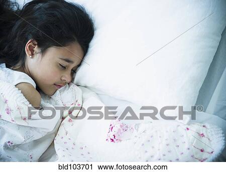 Mixed race girl sleeping in bed View Large Photo Image Stock Image - Mixed race girl sleeping in bed. Fotosearch