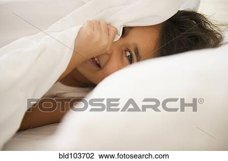 Mixed race girl underneath sheet View Large Photo Image Stock Image - Mixed race girl underneath sheet. Fotosearch