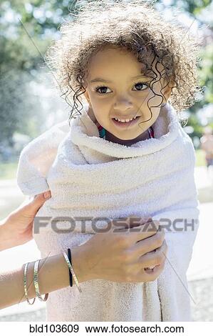 Mixed race girl wrapped in a towel View Large Photo Image Stock Photo - Mixed race girl wrapped in a towel. Fotosearch