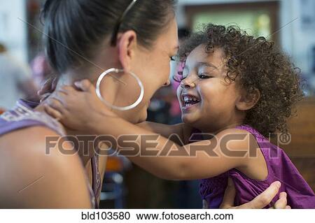Mother and daughter hugging View Large Photo Image Stock Image - Mother and daughter hugging. Fotosearch